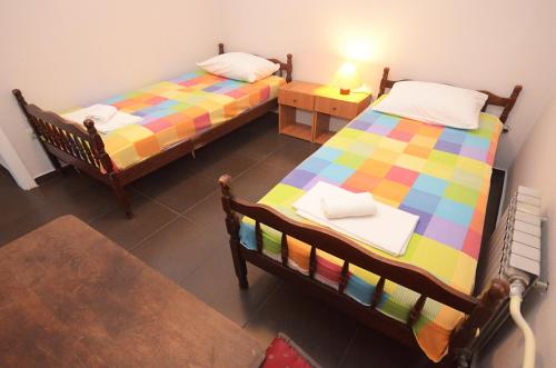 an overhead view of two beds in a room at Apartments Dakovic in Kotor