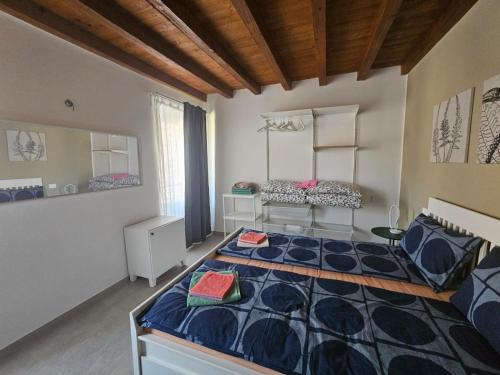 a bedroom with a large bed in a room at La casa di Edone in Monzambano