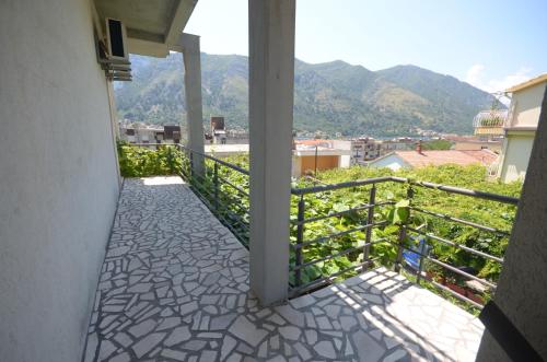 a balcony with a view of the mountains at Apartments Dakovic in Kotor