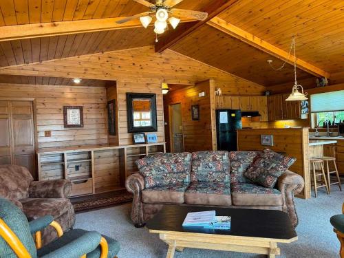 a living room with a couch and a table at Island Cove #9 - On Minocqua Lake in Minocqua