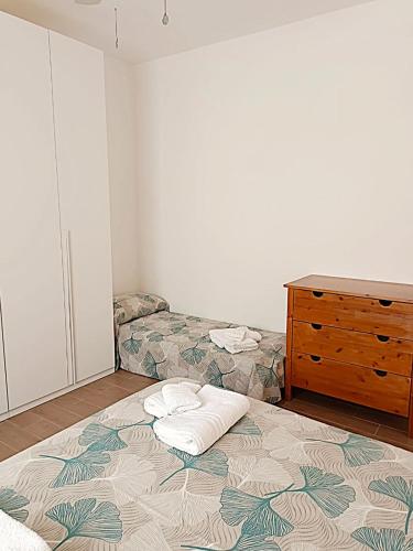 a bedroom with a bed and a dresser in it at Apartment Pescantina in Pescantina