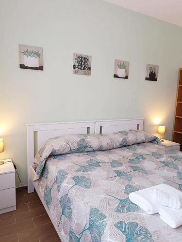 a bedroom with a bed and two pillows on it at Apartment Pescantina in Pescantina