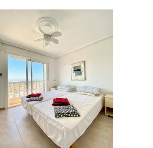 a bedroom with a large bed and a window at Casa Maria with Pool, Terace & Amazing View - near Beach, Golf, Town & Relax - 1-6 Guests in Rojales