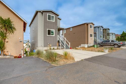 a row of houses in a residential neighborhood at Walk to Beach WFH-Friendly Retreat in Tillamook! in Tillamook