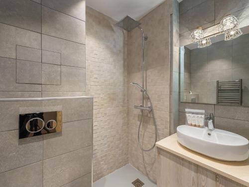 a bathroom with a sink and a shower at Appartement pour 6 avec jacuzzi et vue panoramique - FR-1-570-33 in Saint-Martin-de-Belleville