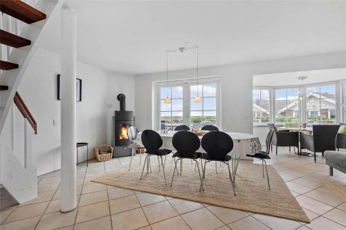 a living room with a dining table and chairs at 0287-Romo-Sonder-Frankel-28 in Havneby