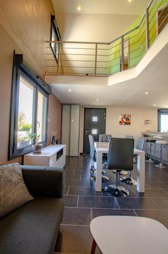 a living room with a couch and a table at Chez mimi in Plessis-Barbuise