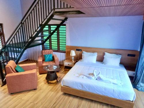 Postel nebo postele na pokoji v ubytování Mercure Resort Wayanad