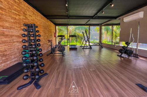 a fitness room with a gym with exercise equipment at Villa Naluri - Seu Refúgio a 50 metros da praia em Japaratinga in Japaratinga