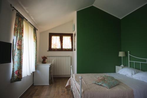 Un ou plusieurs lits dans un hébergement de l'établissement Campidoglio Bed and Breakfast