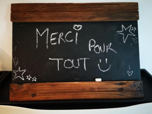 a blackboard with the words merrettroth put out at Hummingbird Room - Modern & Cozy with Bistro Area in Mansonville