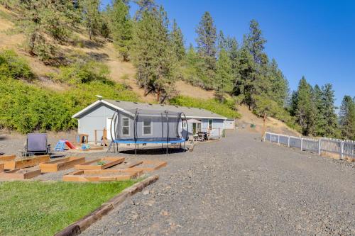 an rv parked on the side of a hill at Mtn-View Gem with Outdoor Entertainment in Ahsahka! 