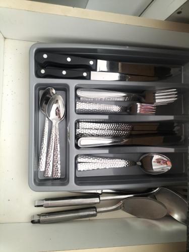 a drawer filled with silver utensils in a drawer at Gracious Beauty in Bloemfontein