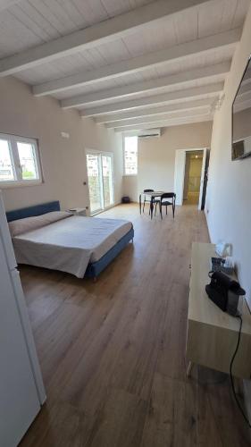 a large bedroom with a bed and two tables at Raggio di Sole 5 P4 in Bari