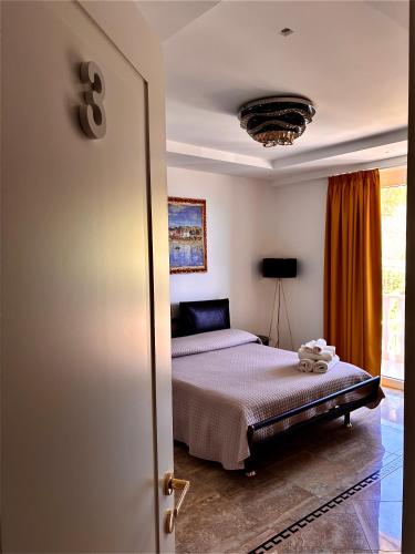 a bedroom with a bed and a room with a window at Marlou Health&Fit Club in Buccino