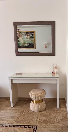 a white desk with a stool in a room at Marlou Health&Fit Club in Buccino