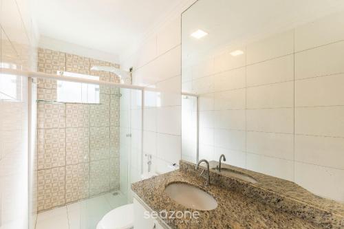a bathroom with a sink and a toilet at Apto c/ Vista Mar a 200m da Praia TSR0501 in Cururupe