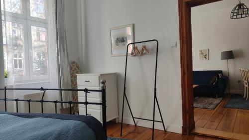 a bedroom with a bed and a room with a mirror at Prad 543 in Poznań