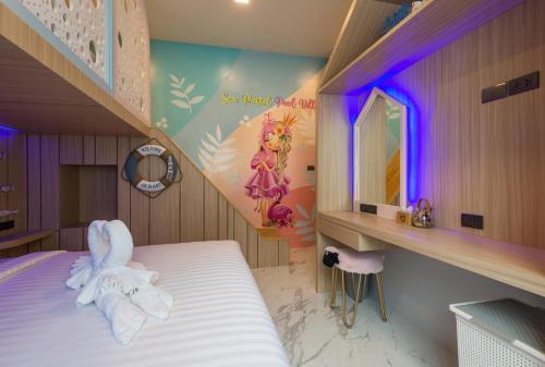 a childs bedroom with a bed with a bunny on it at The Tropical Pool Villas Ao Nang Group Krabi in Ao Nang Beach