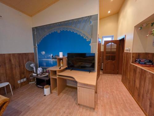 an office with a desk with a laptop computer on it at Family house in Dobele in Dobele