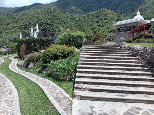 a set of stairs in front of a house at Casa Vinca in San Juan Cosalá