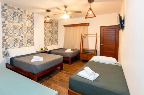 a room with two beds and a mirror at Suucilha in Valladolid