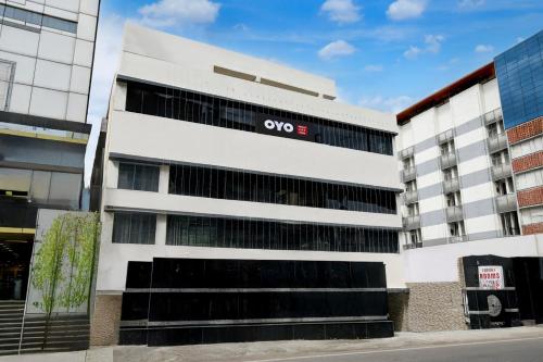 an office building with the company logo on it at Hotel O P R S Elite in Surūrnagar