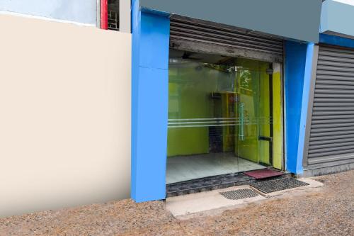 an entrance to a building with a door open at Hotel O The Lord Jagannath Guest House in Puri