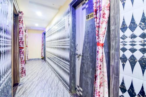a corridor of a dressing room with curtains at Hotel O The Lord Jagannath Guest House in Puri