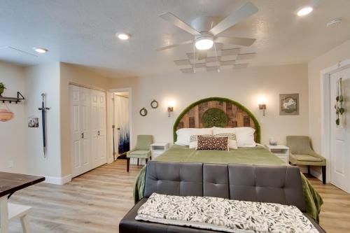 a bedroom with a bed and a ceiling fan at Hike and Explore in Cedar City! Studio Guest Suite in Cedar City