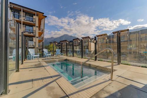 a swimming pool on a building with a building at Timberstone Condo by Canadian Rockies Vacation Rentals in Canmore