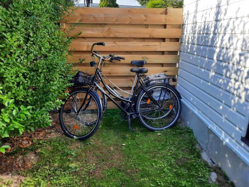 a bike is parked next to a fence at Chalet V14 4pers in Makkum