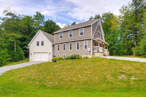 a large house on a grassy hill at 2 Mi to Golfing and Hiking Spacious Wilmington Home in Wilmington