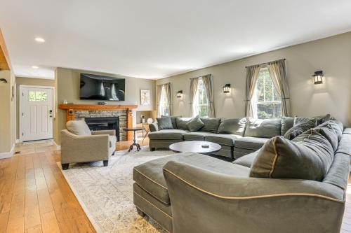 a living room with couches and a fireplace at 2 Mi to Golfing and Hiking Spacious Wilmington Home in Wilmington