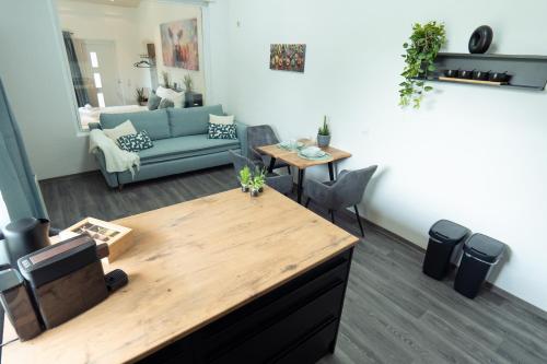 a living room with a couch and a table at Wohlfühlapartment - Künzell in Künzell
