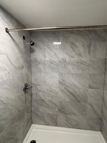 a bathroom with a shower with a glass door at Anchor inn in New Johnsonville