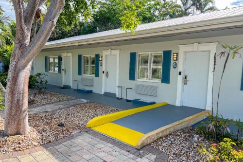 a house with a yellow mattress on the porch at Marco Island Lakeside Inn in Marco Island