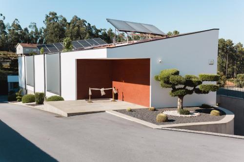 a house with a solar panel on top of it at Maison Vale in Amarante