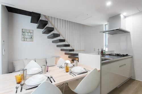a kitchen and dining room with a table and chairs at CAN LI ASSO - Vacation STAY 25225v in Minami Aso