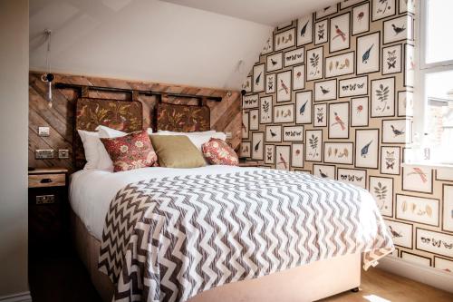 a bedroom with a zebra print wall at The Queen's Head in Kingston upon Thames