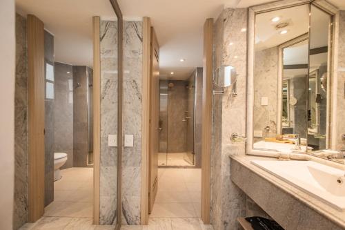 a bathroom with a sink and a shower at Hotel Portón de la Cabrera in Bogotá