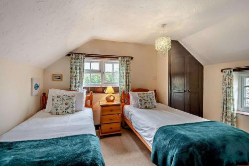 Ένα ή περισσότερα κρεβάτια σε δωμάτιο στο Barmstone Cottage