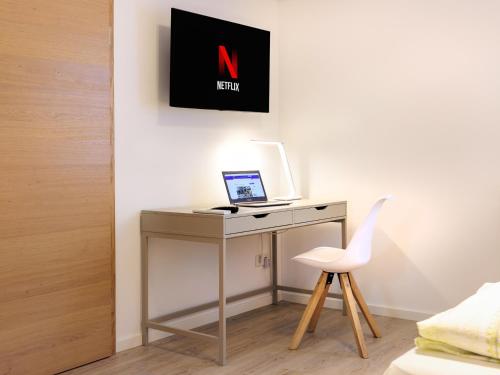 TV a/nebo společenská místnost v ubytování Modern Home Check-in & chill down auf 65 qm²