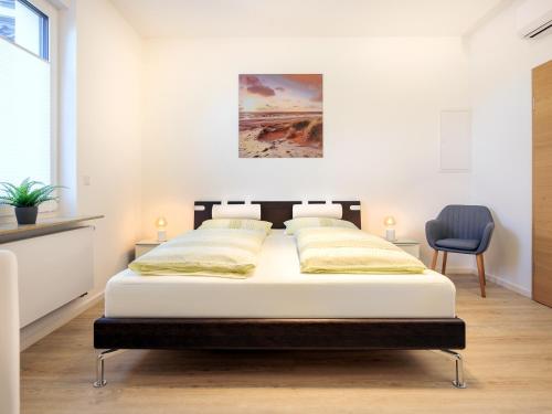 Postel nebo postele na pokoji v ubytování Modern Home Check-in & chill down auf 65 qm²