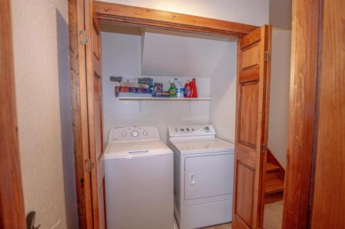 a small laundry room with a washer and dryer at Tahoe Haven By Hauserman Rentals in Carnelian Bay