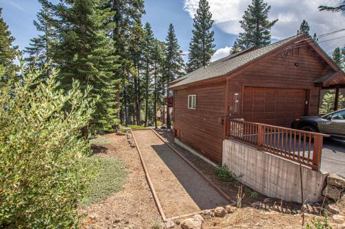 a small wooden building with a car parked in front of it at Tahoe Haven By Hauserman Rentals in Carnelian Bay