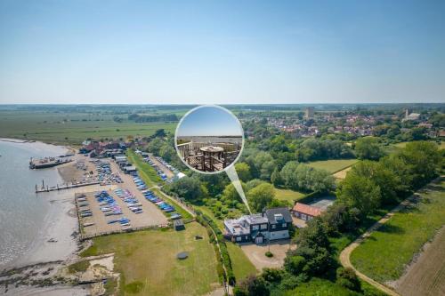 an overhead view of a beach with a large mirror at The Pavilion in Orford