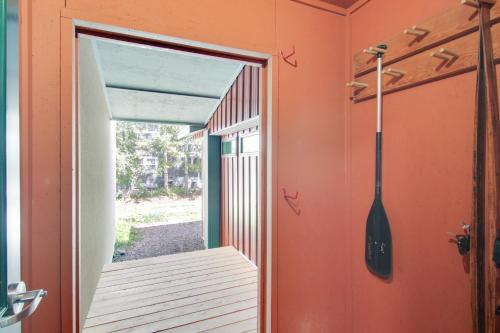 a room with a door open to a porch at Bear House - 3 Blocks to Downtown Main St Bozeman! in Bozeman