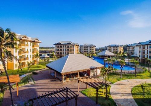 an apartment complex with a gazebo and a resort at VG Sun Cumbuco - Praia e Tranquilidade in Caucaia