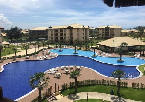 arial view of a large swimming pool at a resort at VG Sun Cumbuco - Praia e Tranquilidade in Caucaia